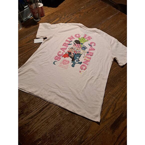 New Care Bears x Universal Monsters Tee NWT Women’s L 12-14 Pink Graphic Shirt - Picture 2 of 2